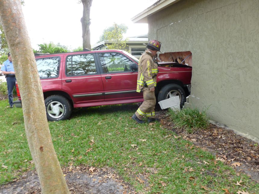 Damaged vehicle being documented after a collision
