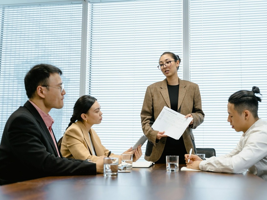 Parties seated around a table during a claim mediation