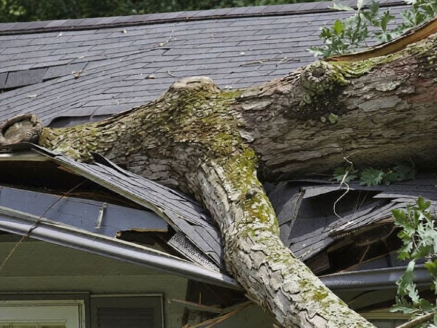 Residential rooftop being inspected for storm damage